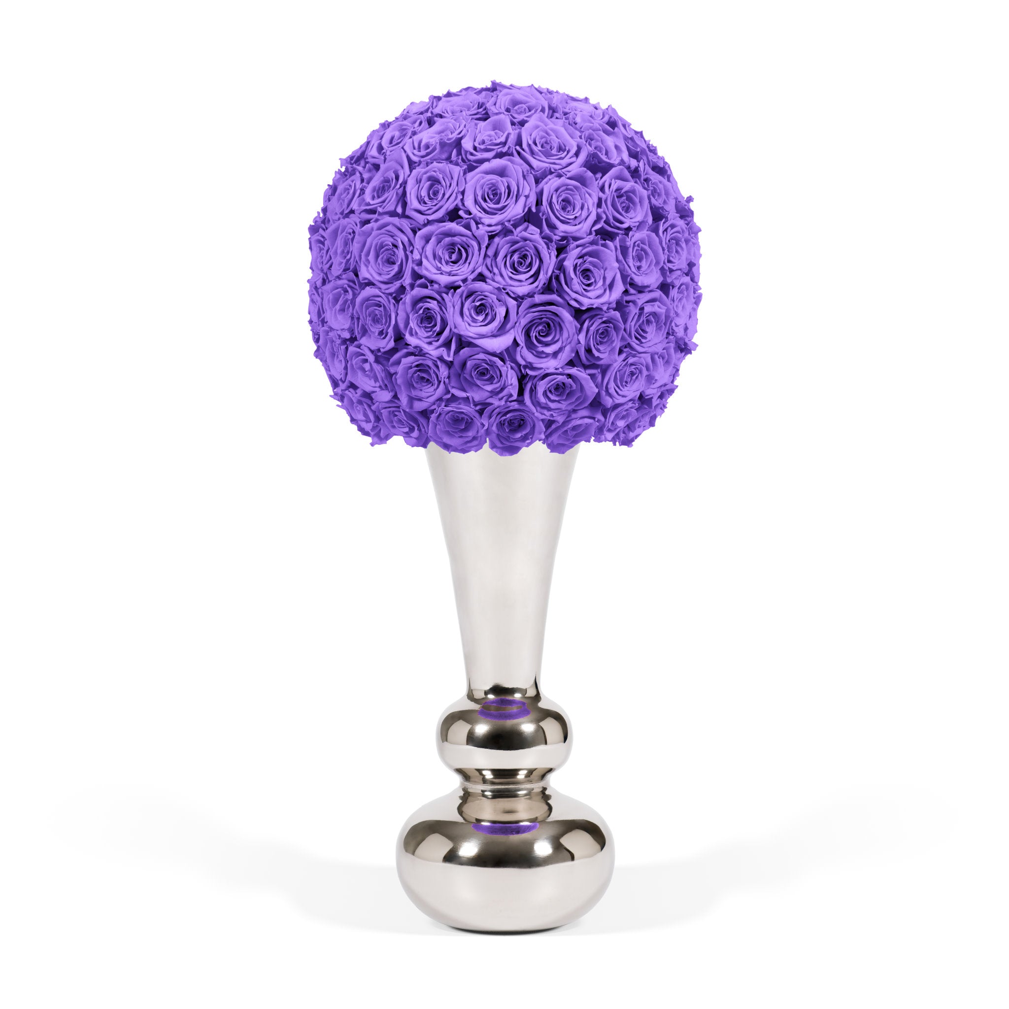 Purple floral arrangement on a silver stand against a white background