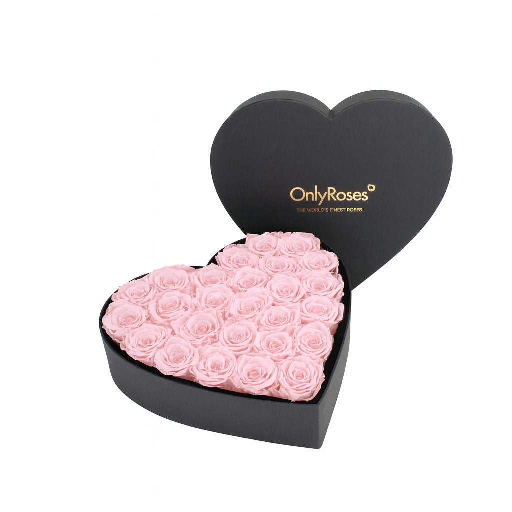 Heart-shaped box of pink roses with 'OnlyRoses' branding on a white background