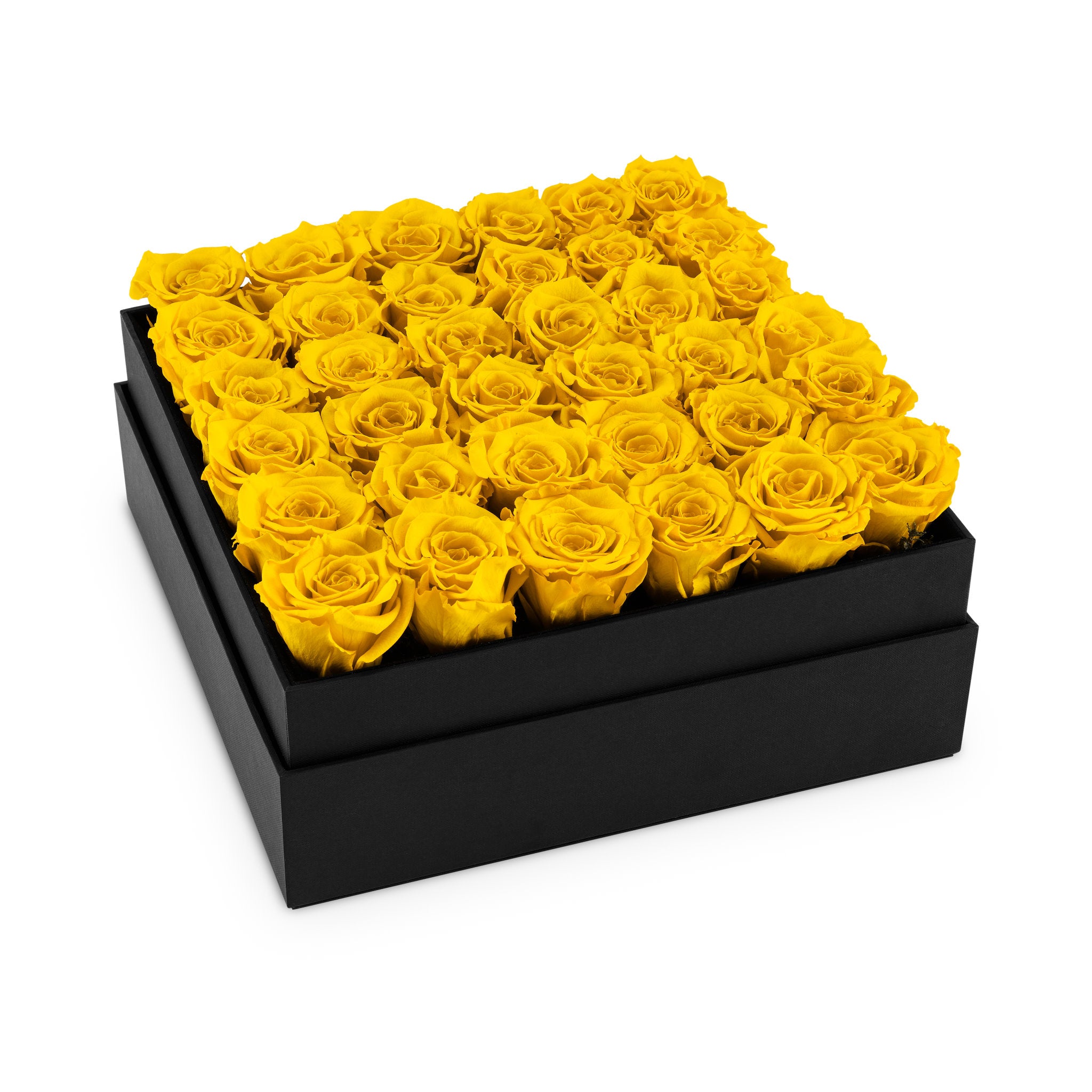 Black box filled with yellow roses on a white background