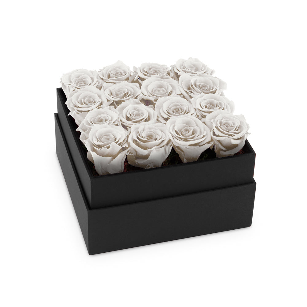 Black box with white roses on a white background