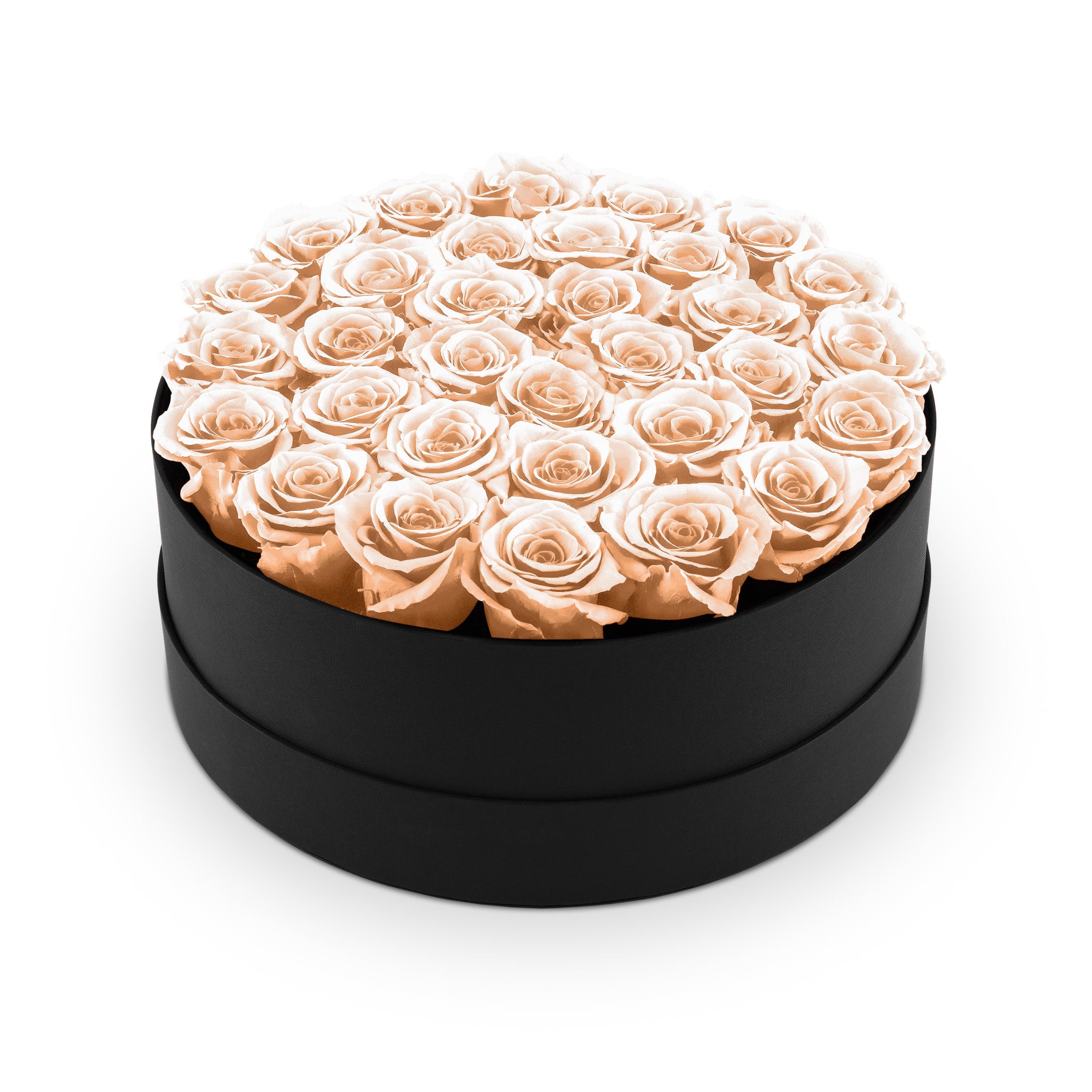 Round black box filled with peach roses on a white background