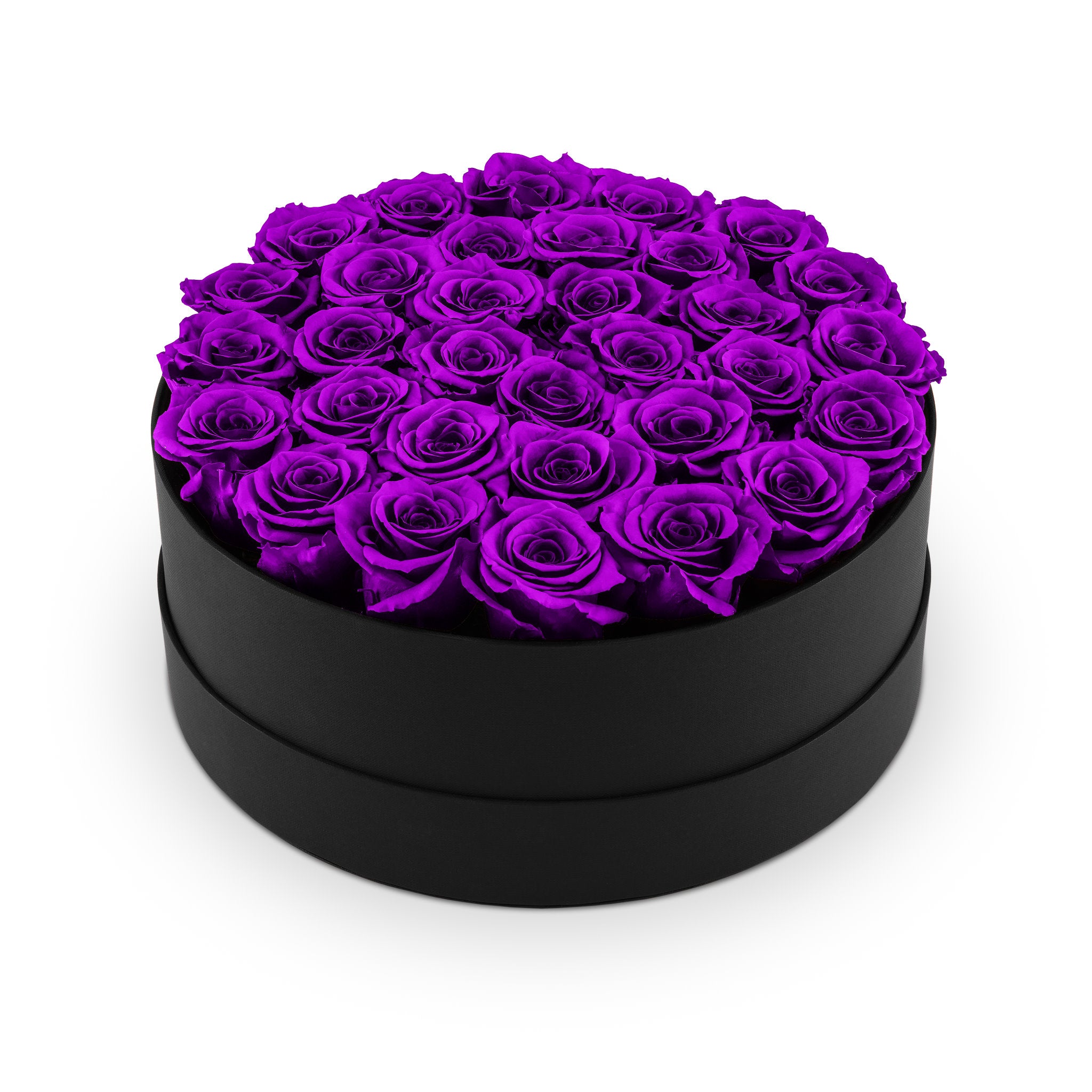Heart-shaped box filled with purple roses on a white background