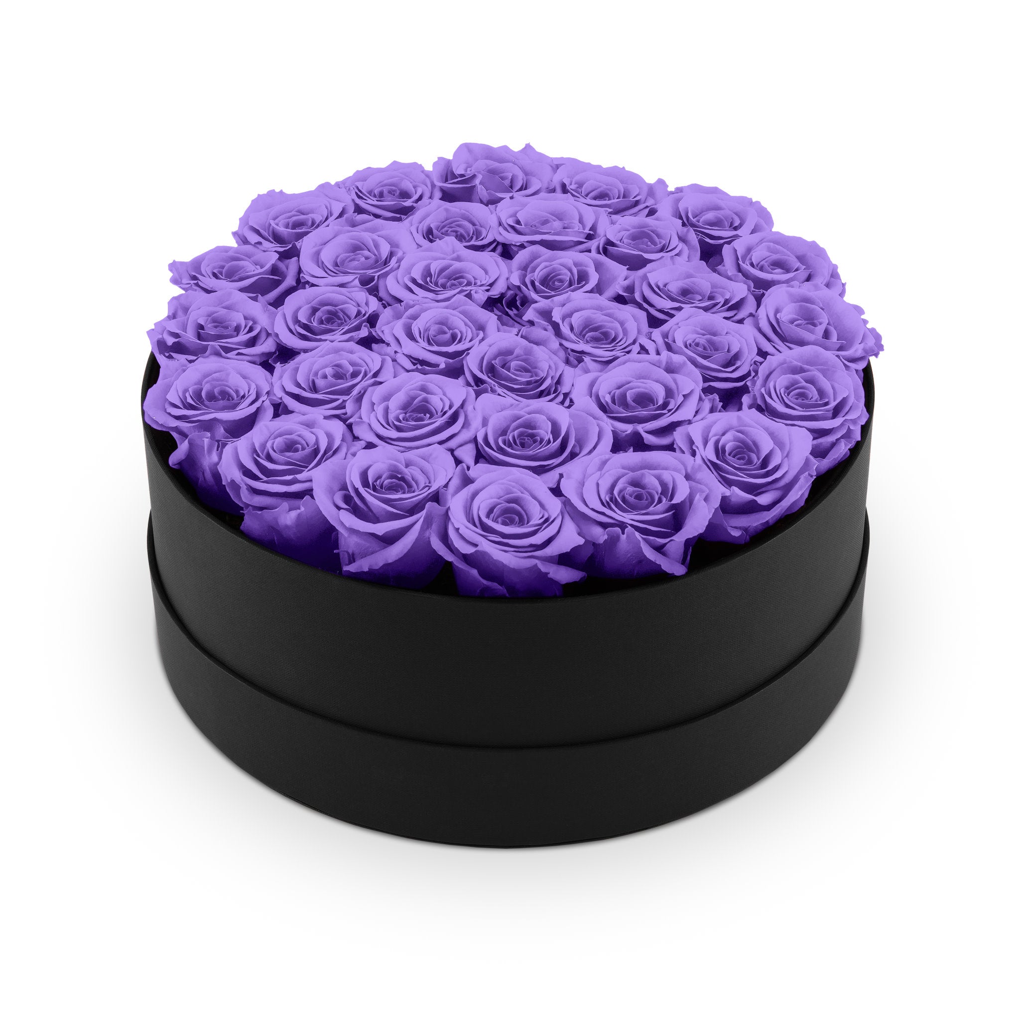 Black round box filled with purple roses on a white background