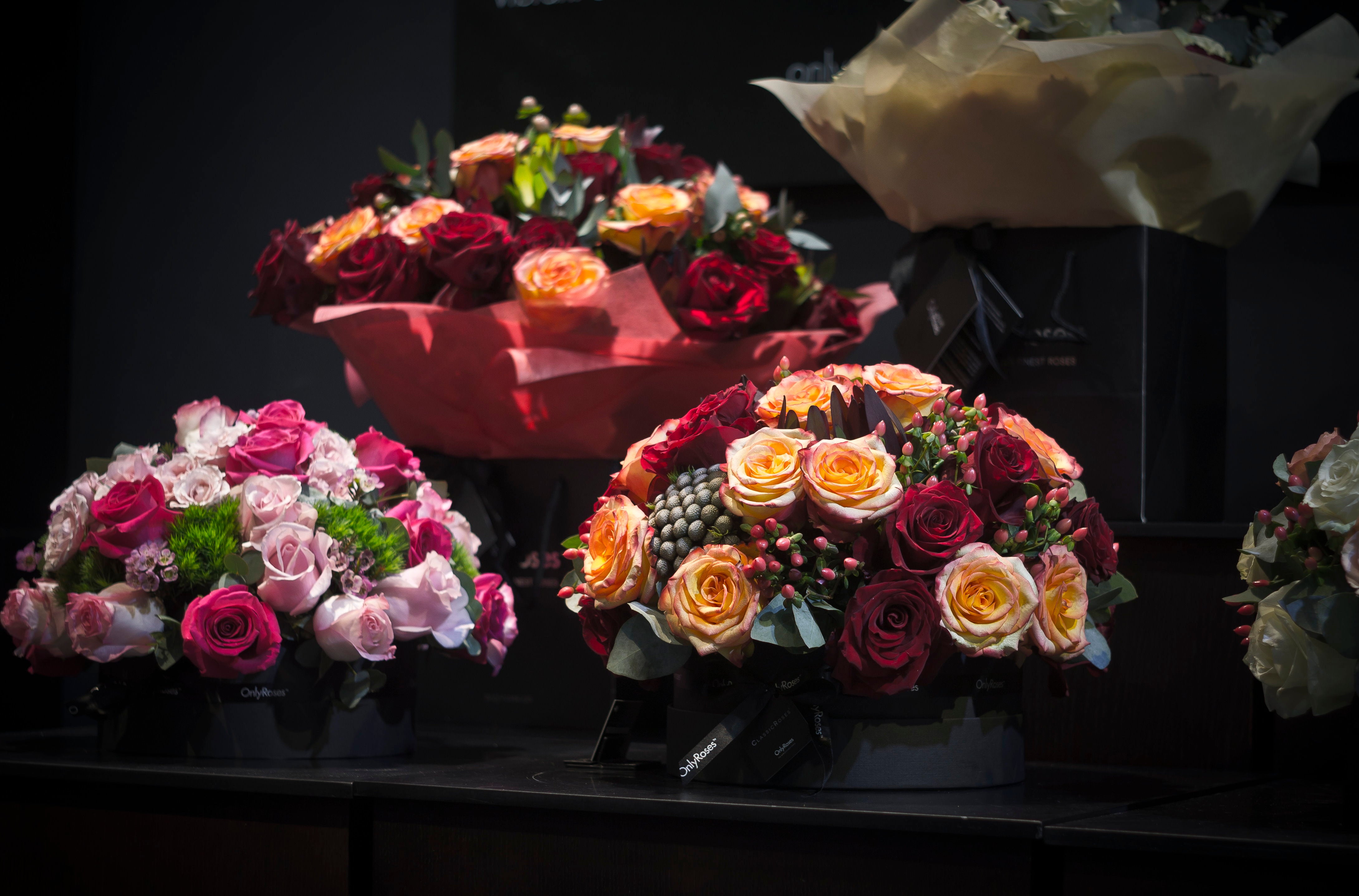 Bouquets of flowers on a dark surface