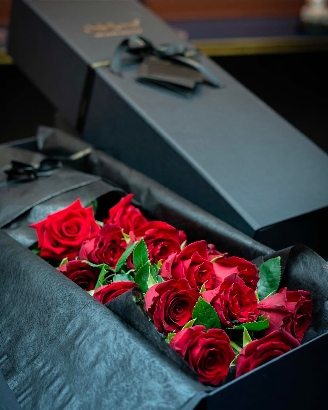 Black Gesture gift box branded OnlyRoses with red roses