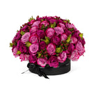 Bouquet of pink and purple roses in a black box on a white background