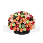 Colorful flower arrangement with roses and succulents in a black box on a white background