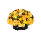Bouquet of yellow and orange roses with greenery on a white background