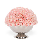 Bouquet of pink roses in a silver vase on a white background