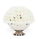 Bouquet of white flowers in a silver vase on a white background