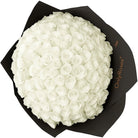 Bouquet of white roses in a black box with 'Only Roses' branding.