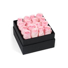 Black box with pink roses on a white background