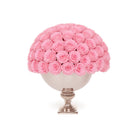 Decorative sphere filled with pink roses on a white background