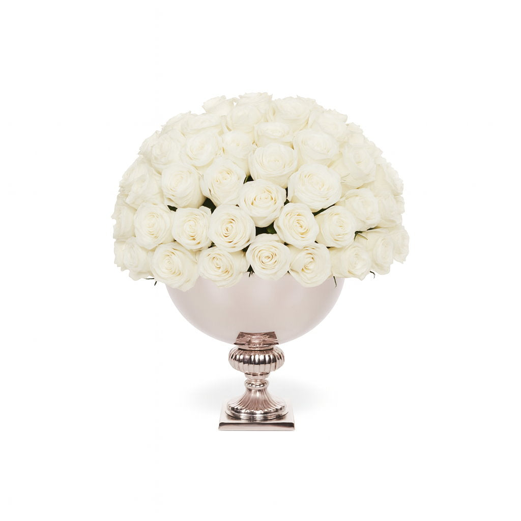 Bouquet of white roses in a decorative vase on a white background