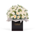 Bouquet of white roses in a box with 'Only Roses' branding on a white background