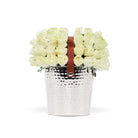 Silver bucket with white flowers and a brown leather strap on a white background
