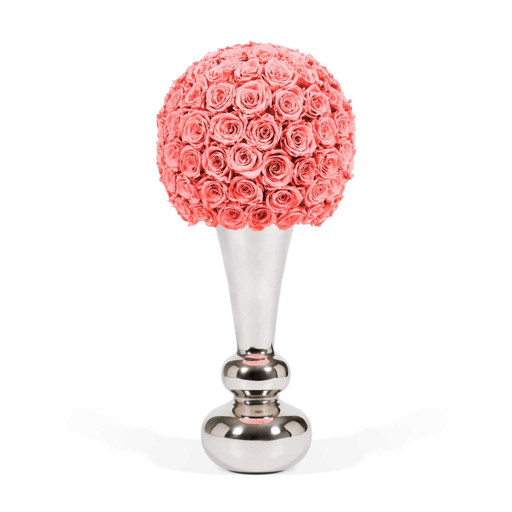 Decorative item with coral-colored rose ball on a silver stand against a white background