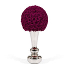 Decorative vase with a ball of red roses on a white background