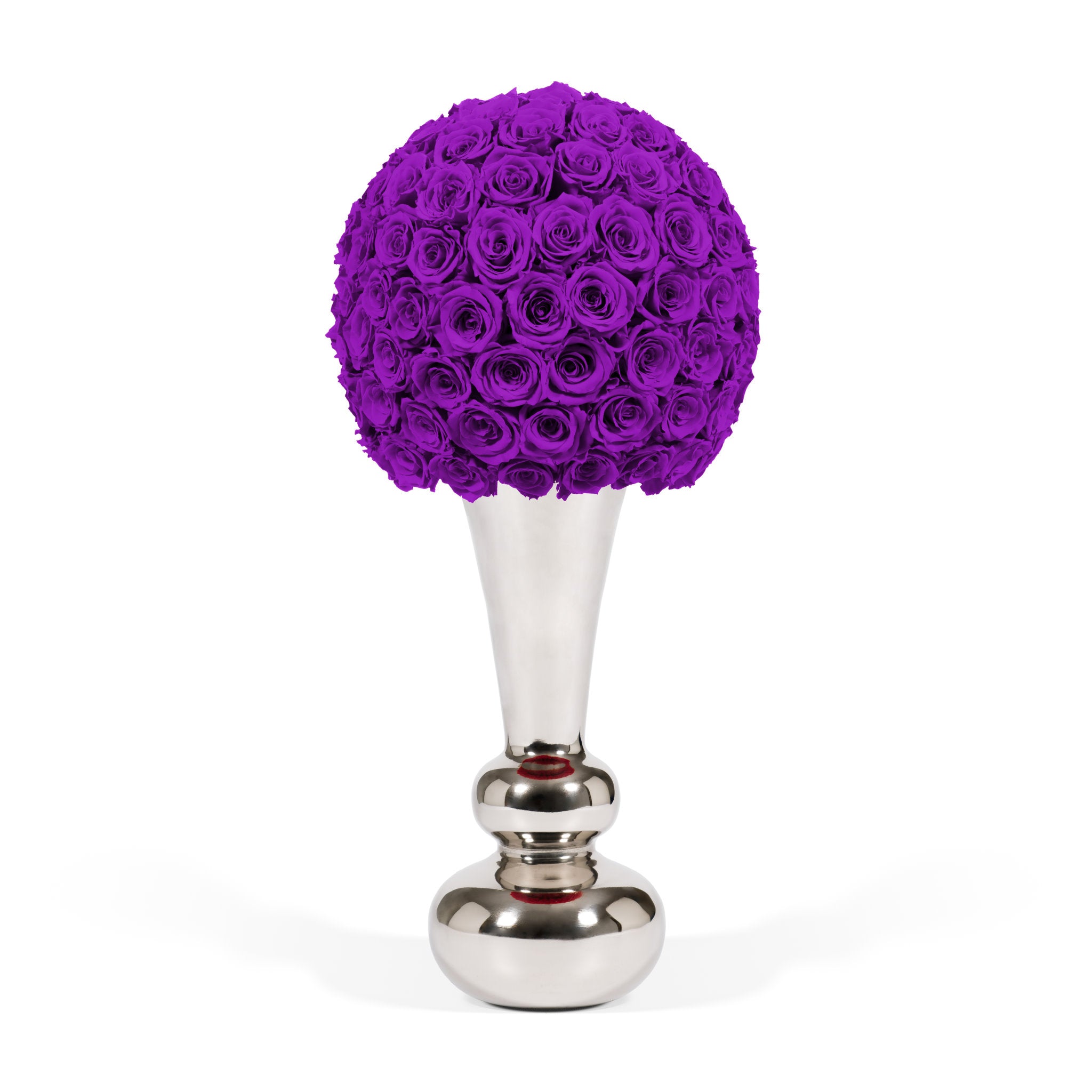 Purple rose arrangement in a silver vase on a white background