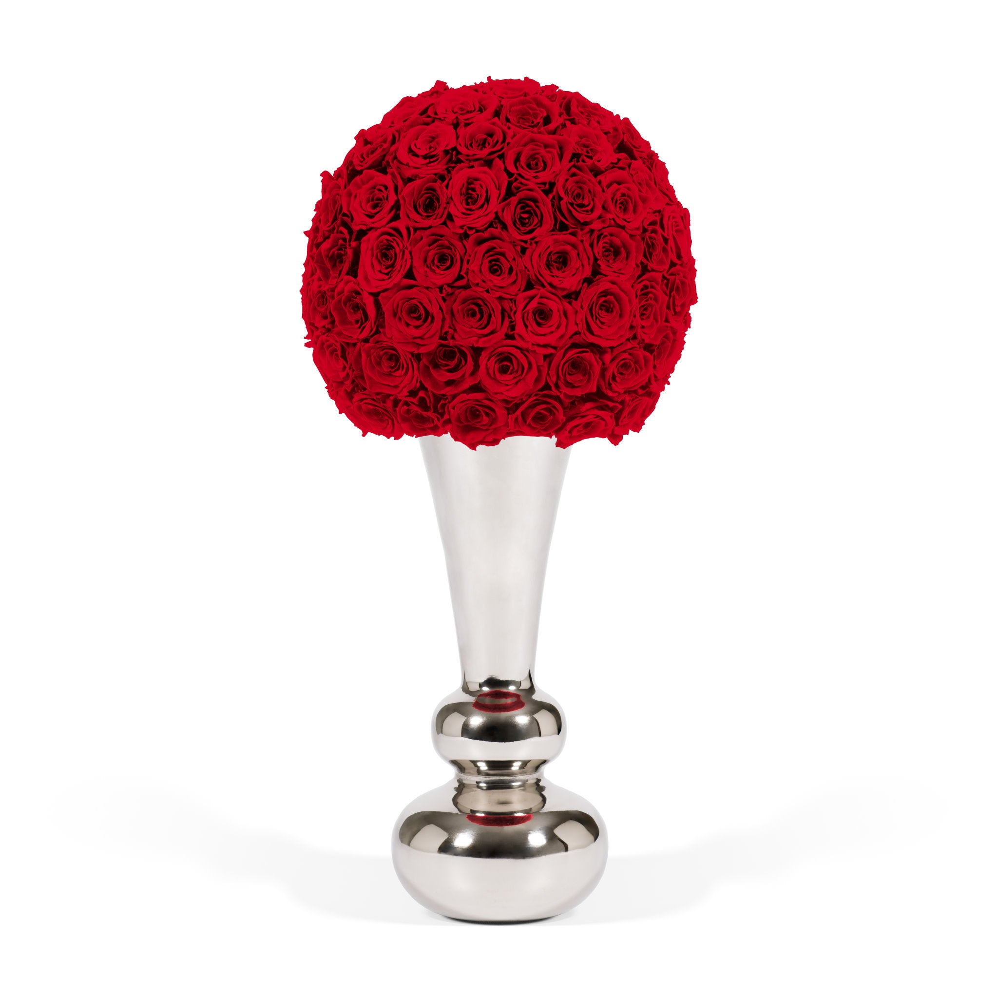 Decorative item with red rose ball on a silver stand against a white background