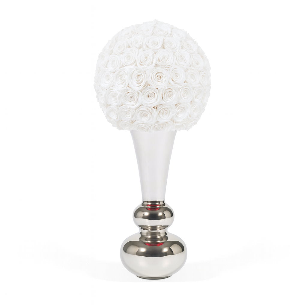 Decorative object with white spherical top and silver base on a white background
