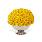 Bouquet of yellow roses in a white vase on a white background