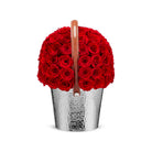 Basket filled with red roses on a white background