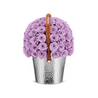 Basket filled with purple roses on a white background