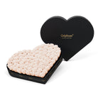 Heart-shaped box of pink roses with 'OnlyRoses' branding on a white background