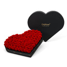 Heart-shaped box of red roses with 'OnlyRoses' branding on a white background