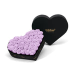 Heart-shaped box of purple roses with 'OnlyRoses' branding on a white background