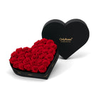 Heart-shaped box of red roses with 'OnlyRoses' branding on a white background