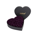 Heart-shaped box of purple roses with 'OnlyRoses' branding on a white background