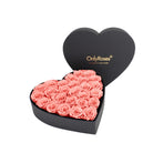 Heart-shaped box of pink roses with 'OnlyRoses' branding on a white background