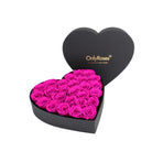 Heart-shaped box of pink roses with 'OnlyRoses' branding on a white background