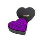 Heart-shaped box of purple roses with 'OnlyRoses' branding on a white background