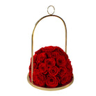 Gold holder with red roses on a white background