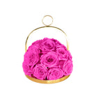 Pink roses in a gold metal basket on a white background