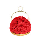 Gold basket with red roses on a white background