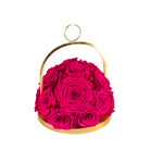 Pink roses in a gold basket on a white background