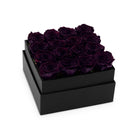 Black box with purple roses on a white background