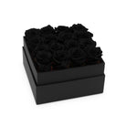 Black box with black roses on a white background