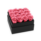Black box with pink roses on a white background