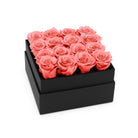 Black box with pink roses on a white background