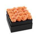Black box with orange roses on a white background