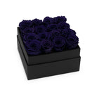 Black box with purple roses on a white background