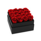 Black box with red roses on a white background