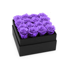 Black box with purple roses on a white background