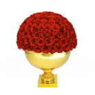 Gold vase with red roses on a white background