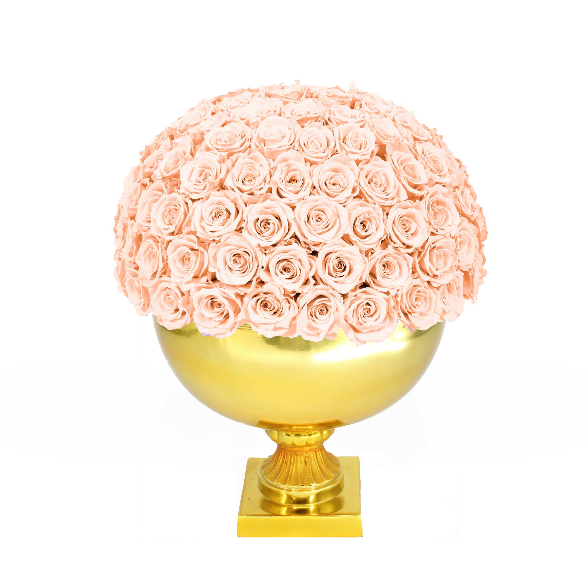 Spherical arrangement of pink roses on a gold pedestal against a white background